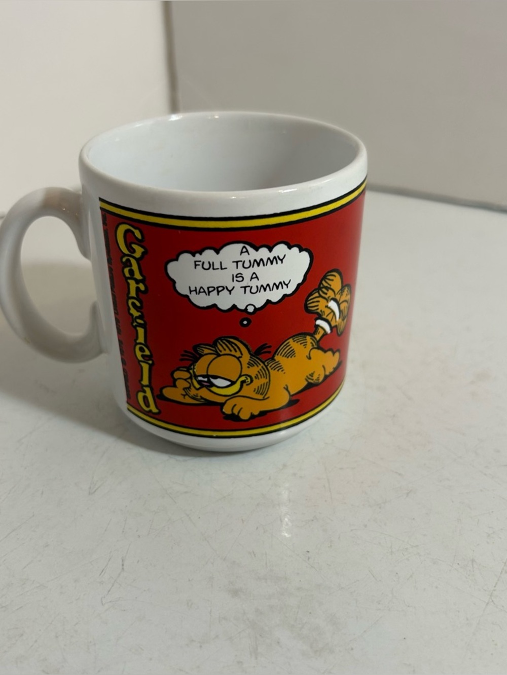 🛍️3/$30 Vintage 1979 Garfield white coffee mug “A full tummy is a happy tummy”